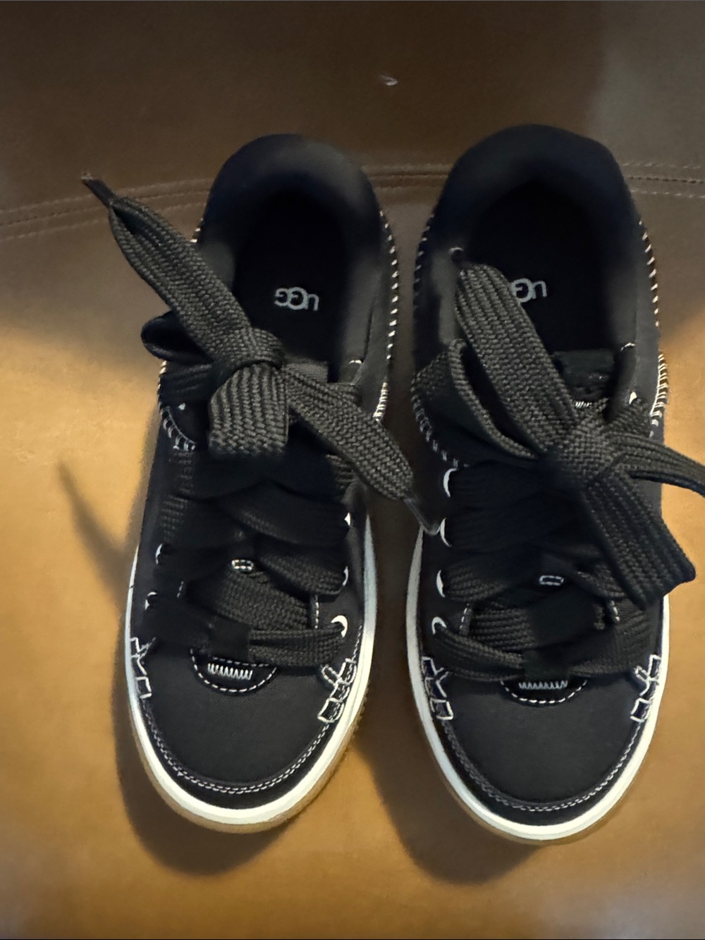 UGG Women’s Black Lace-Up Sneakers with White Sole